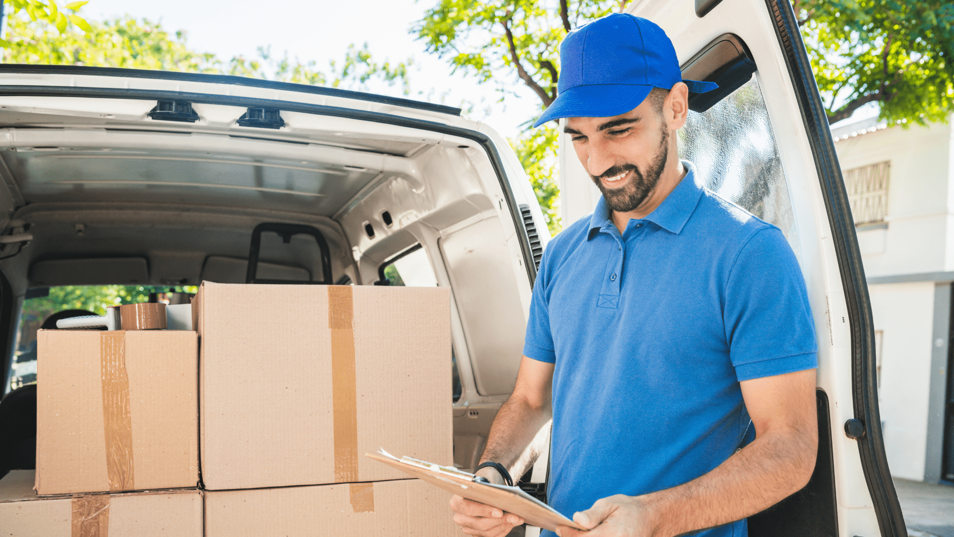 a man holding a courier box